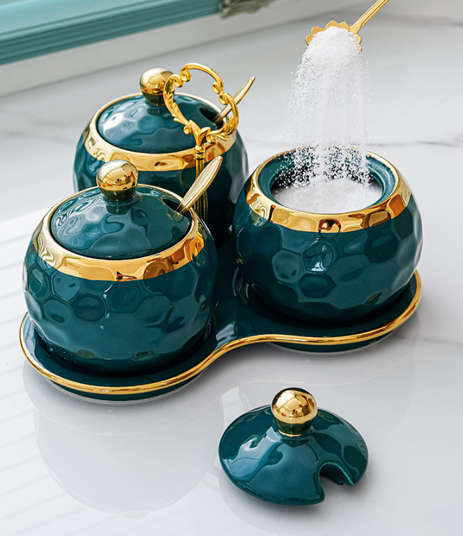 green ceramic condiment jars on matching carrier; supplier reference photograph.