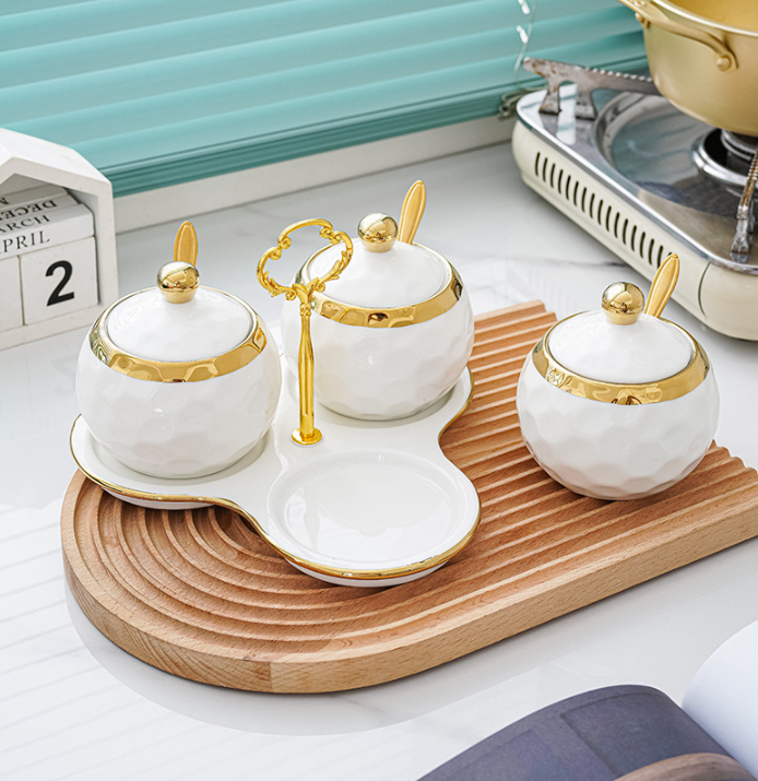 white ceramic condiment jars on matching carrier; supplier reference photograph.