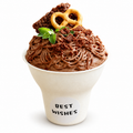 Chocolate dessert styled in an off-white paper dessert cup with a white BEST WISHES sticker on a white background.
