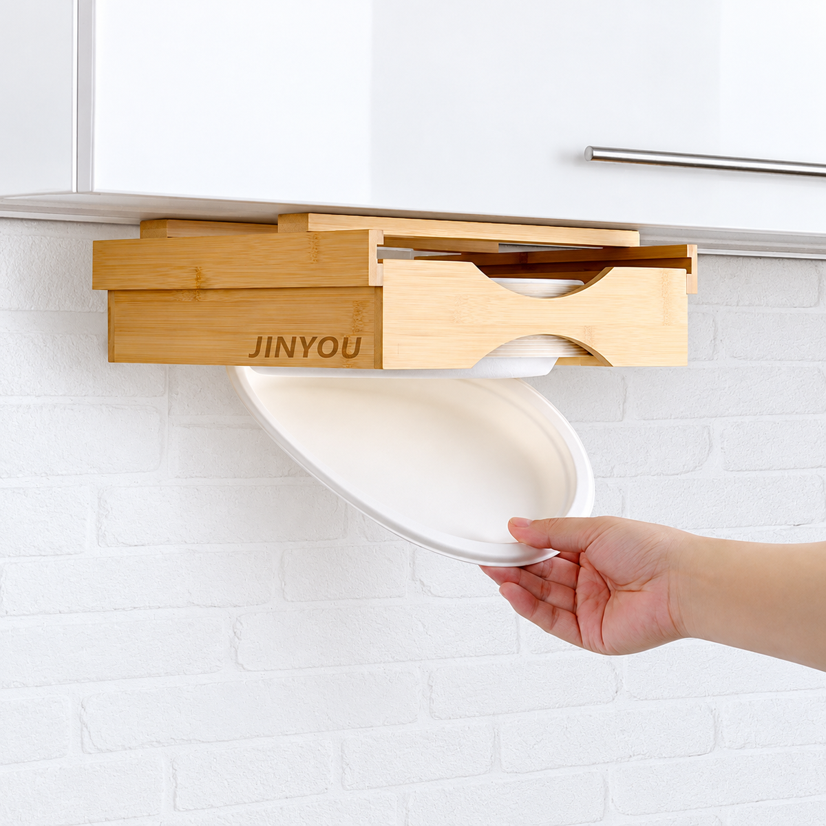 Bamboo under-cabinet paper plate dispenser, use view; styling accessories not included