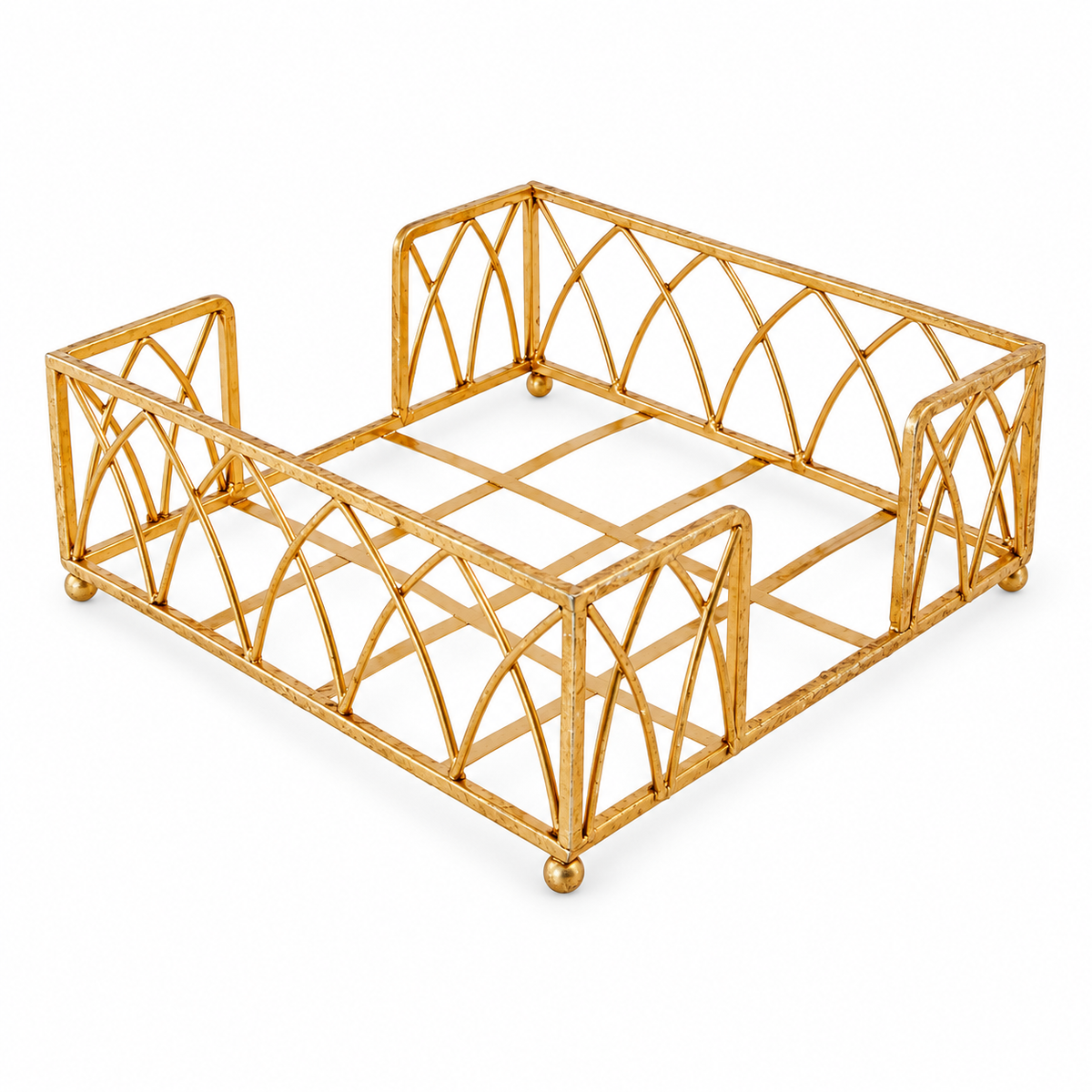 Empty Gold Arch Napkin Caddy on white, showing arch sides, two opposing central access gaps, open grid base and ball feet