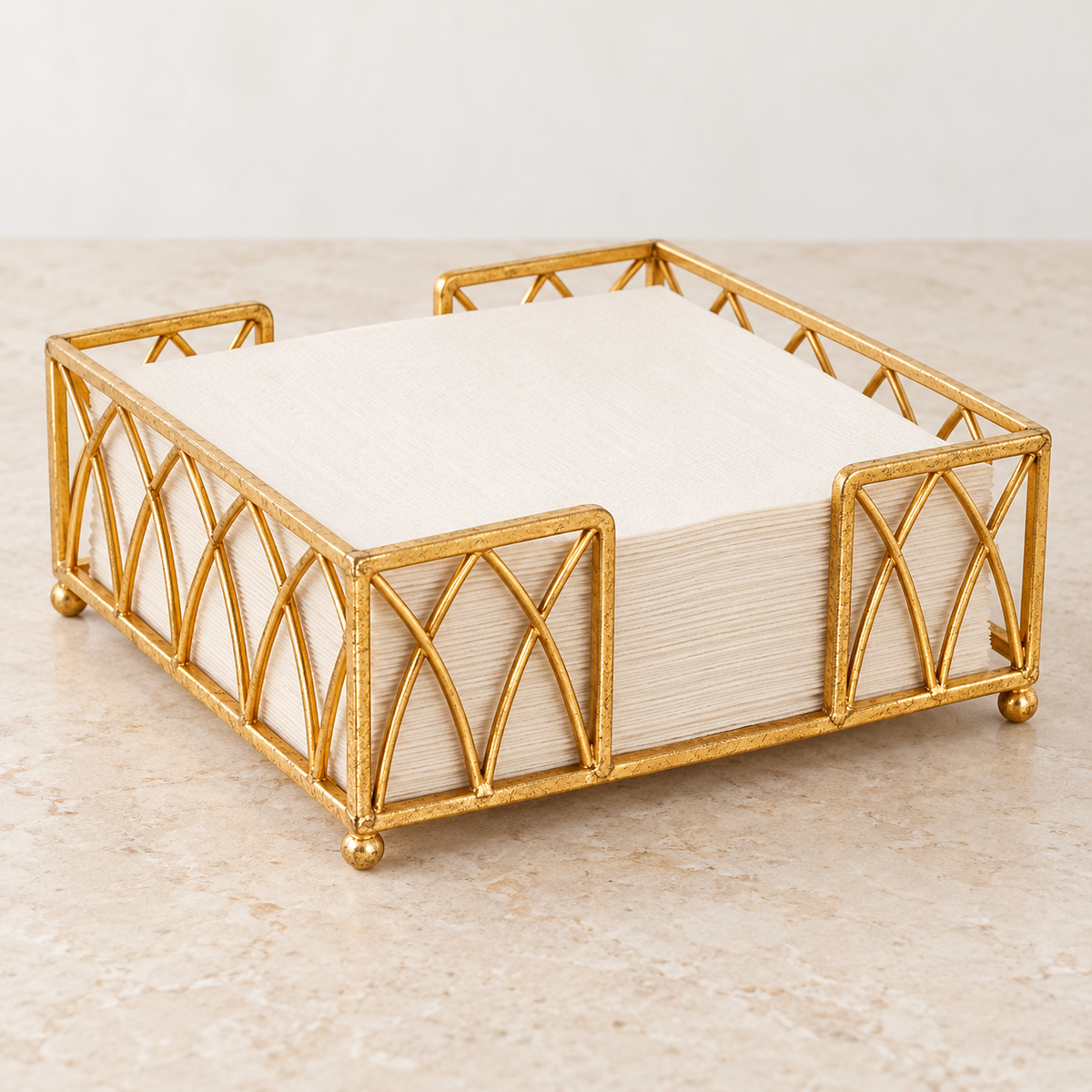 Gold Arch Napkin Caddy side access opening with ivory napkins for styling; napkins not included