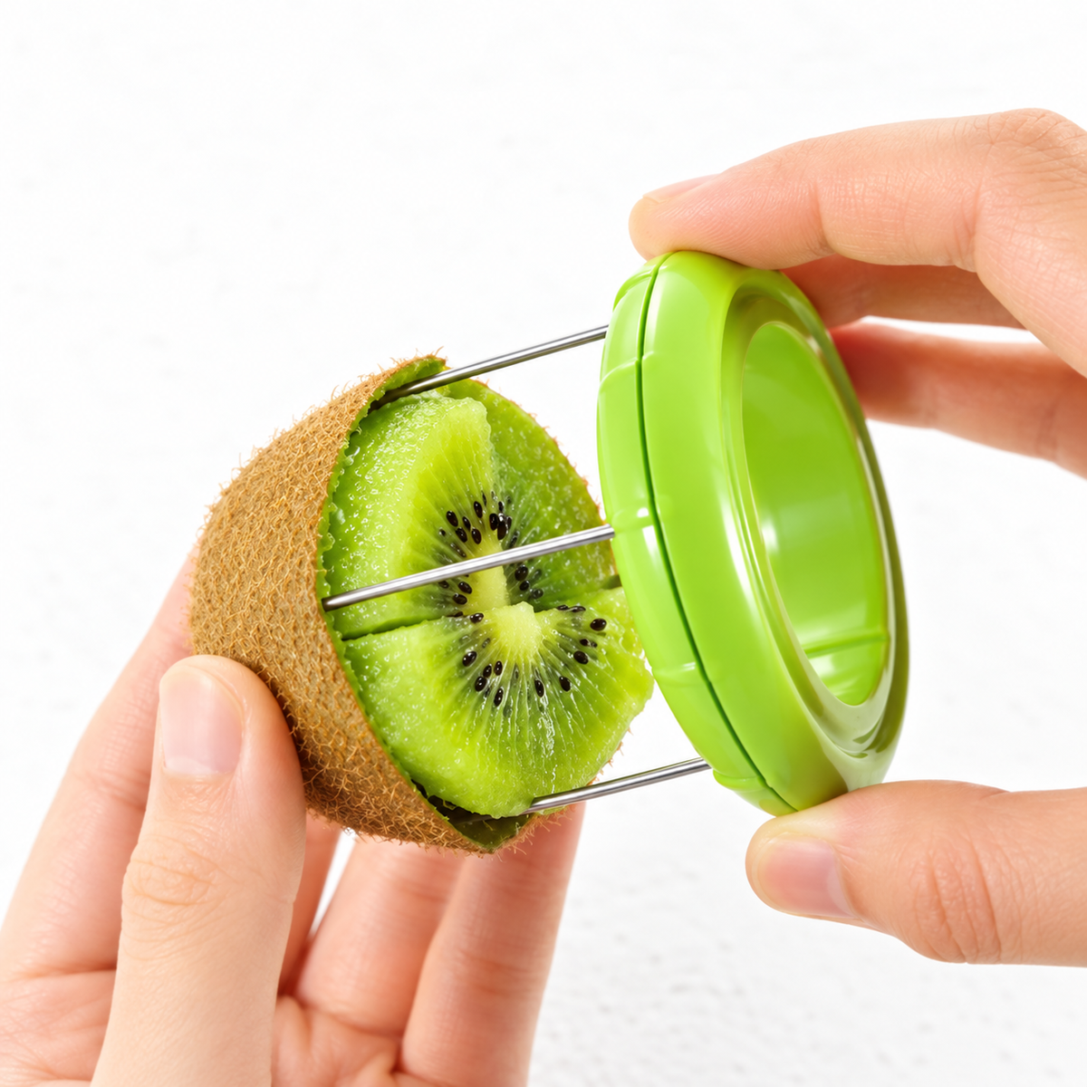 Kiwi peeler wire loops entering a halved kiwi