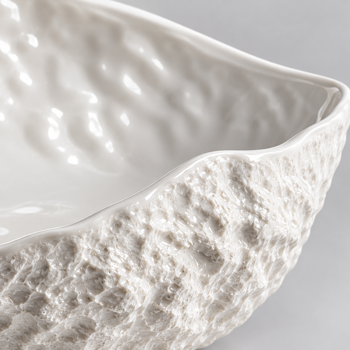 Close-up of rock-textured exterior and glazed wavy rim
