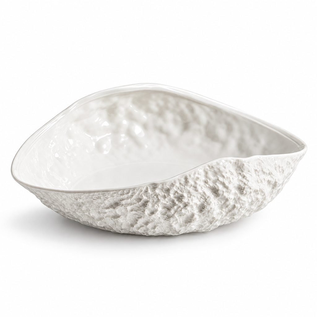 Empty asymmetrical rock-textured white ceramic soup plate on white