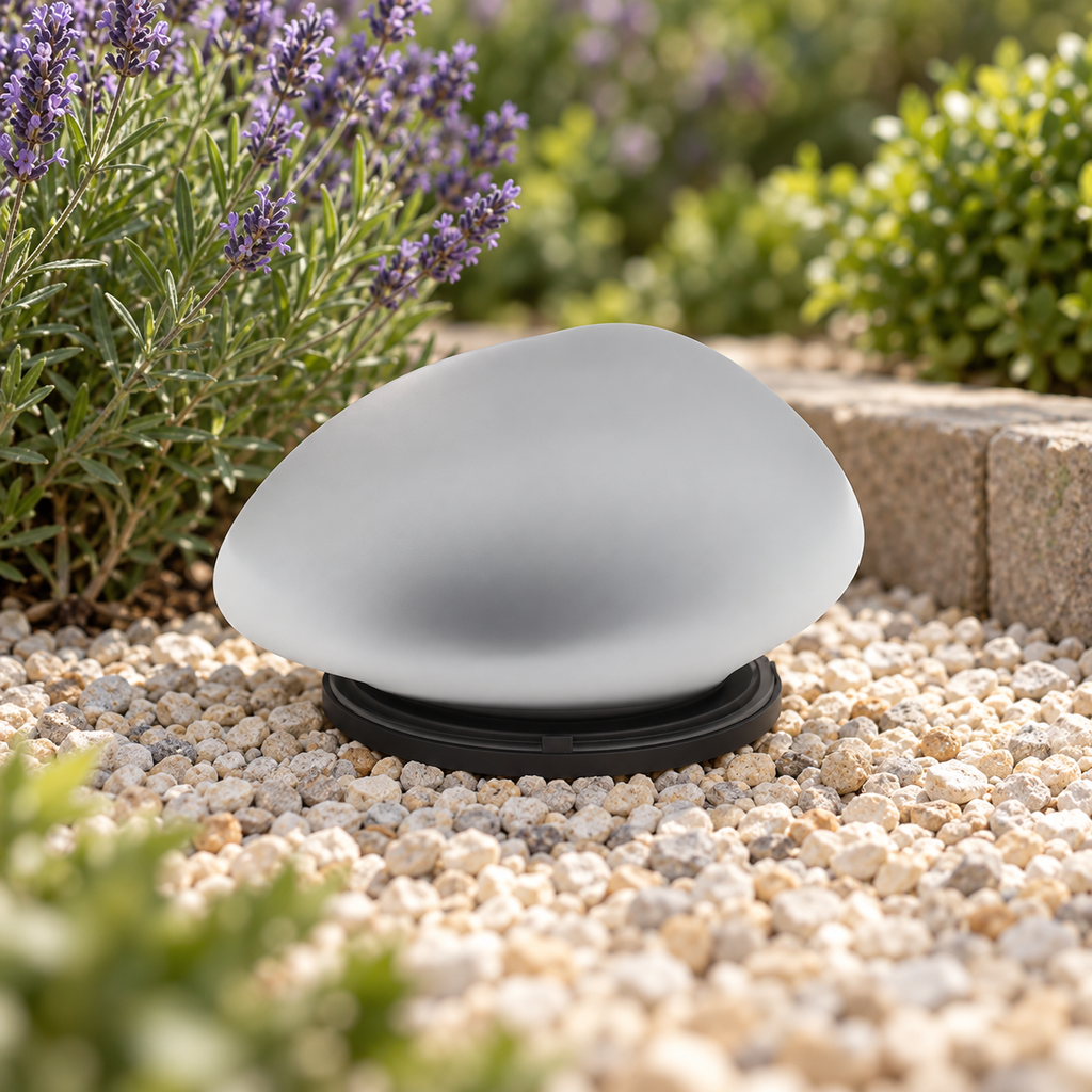 Single pebble garden lamp in daylight