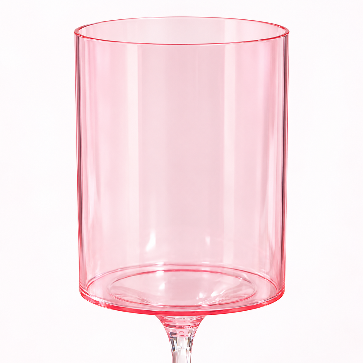 Close-up of the pink goblet bowl and thin rim, showing its translucent cylindrical shape.
