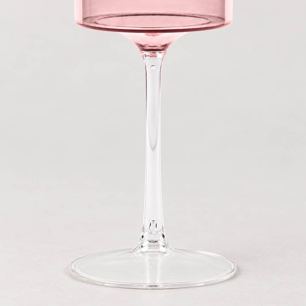 Detail of the clear goblet stem, bowl connection and round base.