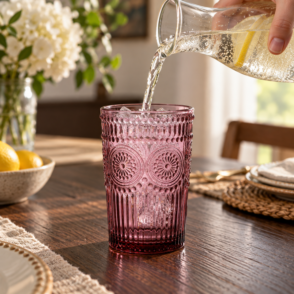 Purple embossed highball glasses: pouring view