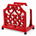Red ornate napkin stand on white, shown with white napkins; napkins not included.