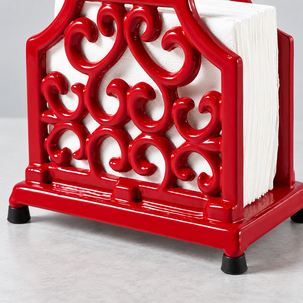 Close view of red scrollwork, base and black feet; napkins and props not included.