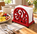 Red scrollwork cast iron napkin holder — breakfast setting; napkins and props not included