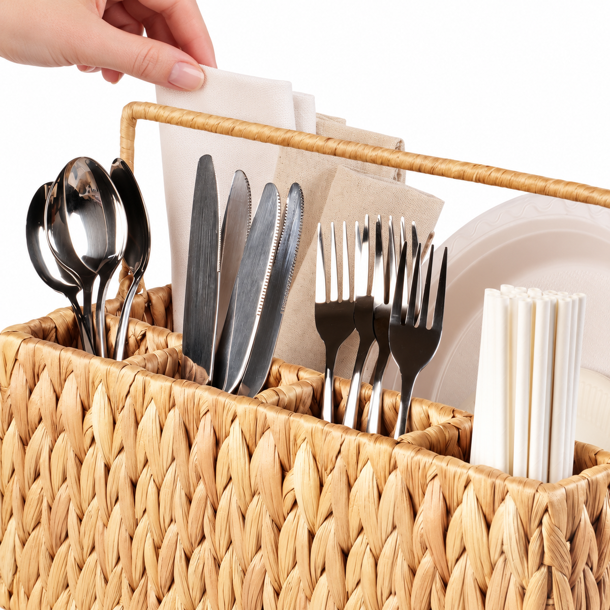 Hand touching a napkin above the cutlery; styling props not included