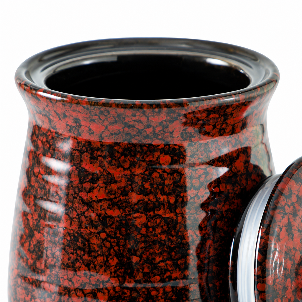 Detail of the dark rim and shoulder of the speckled jar
