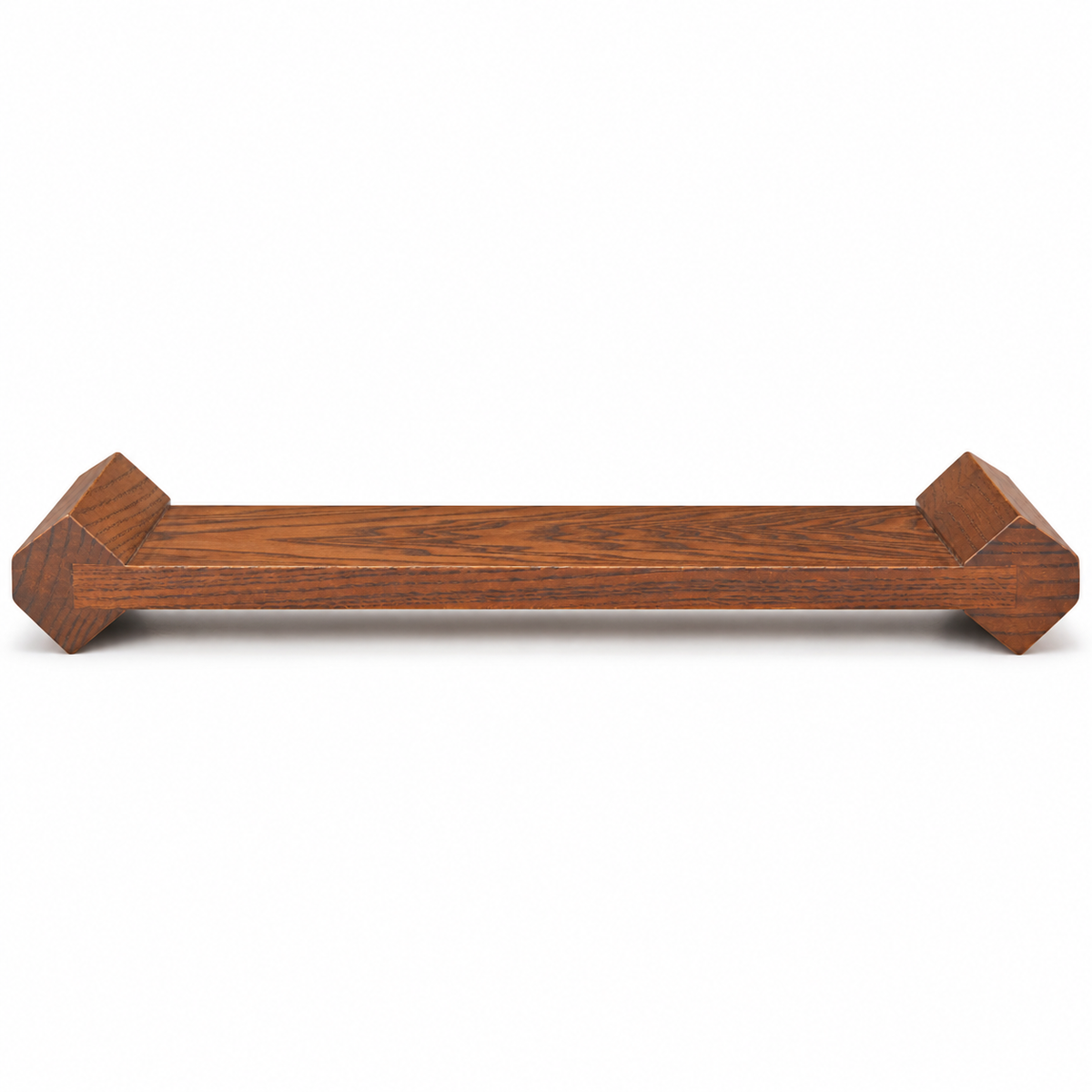 Wooden display riser, low side profile showing slim platform and faceted supporting ends