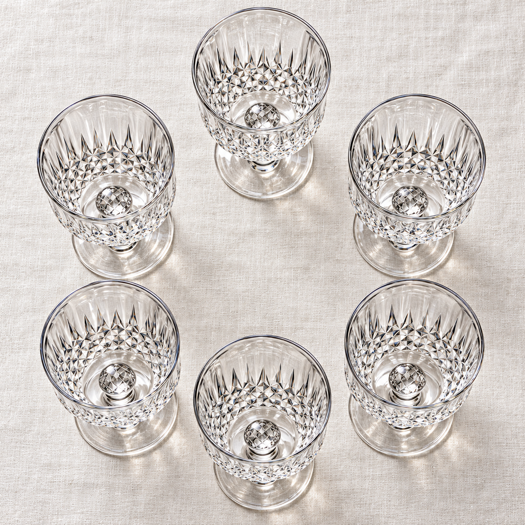 Overhead view of the complete set of six empty diamond-cut goblets