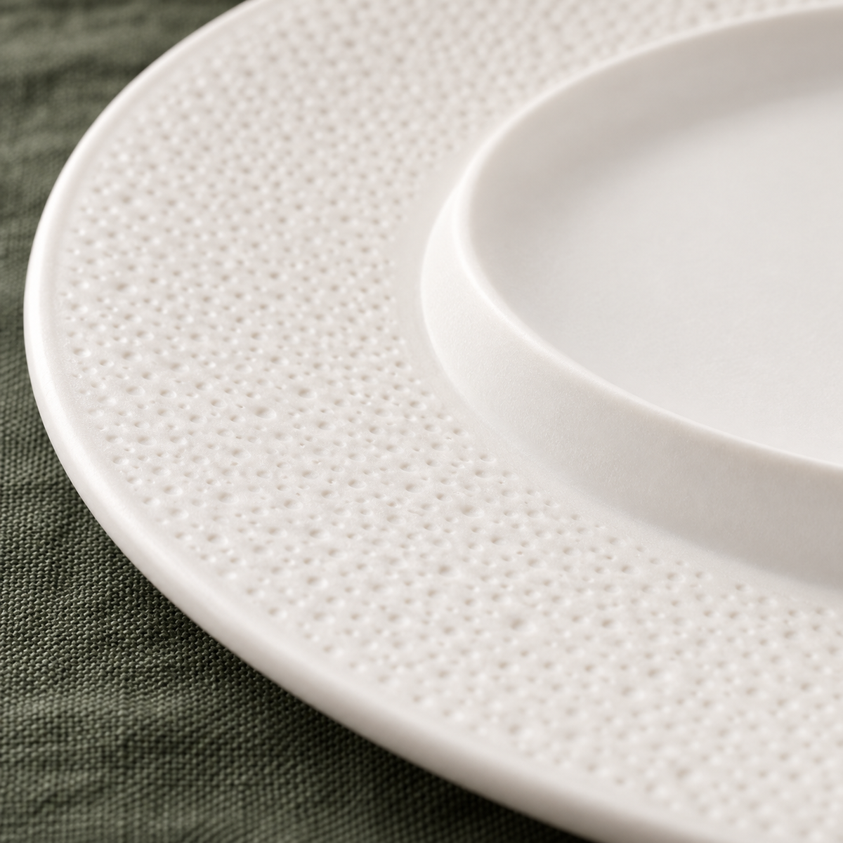 Close-up of fine sesame texture on the matte white ceramic rim