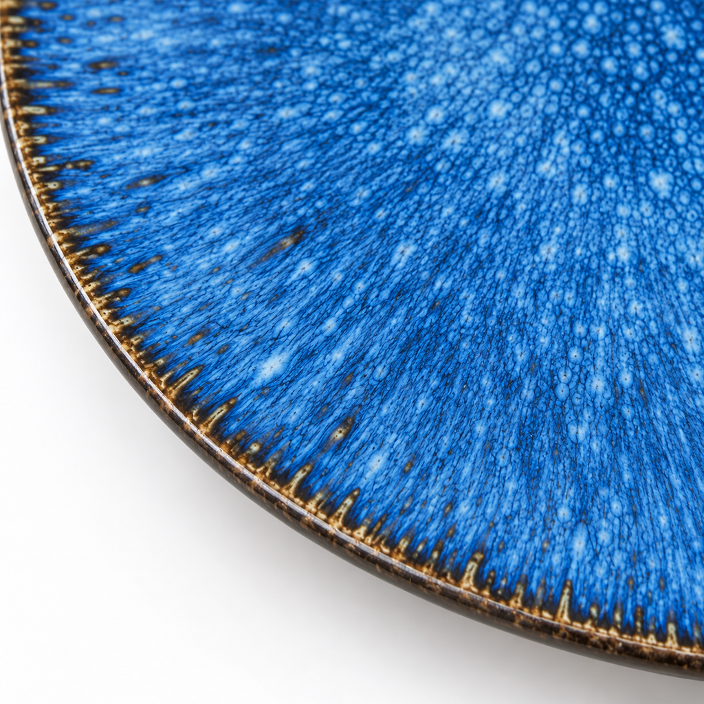 Detail of the kiln-blue radial glaze, fine mottling and dark rim