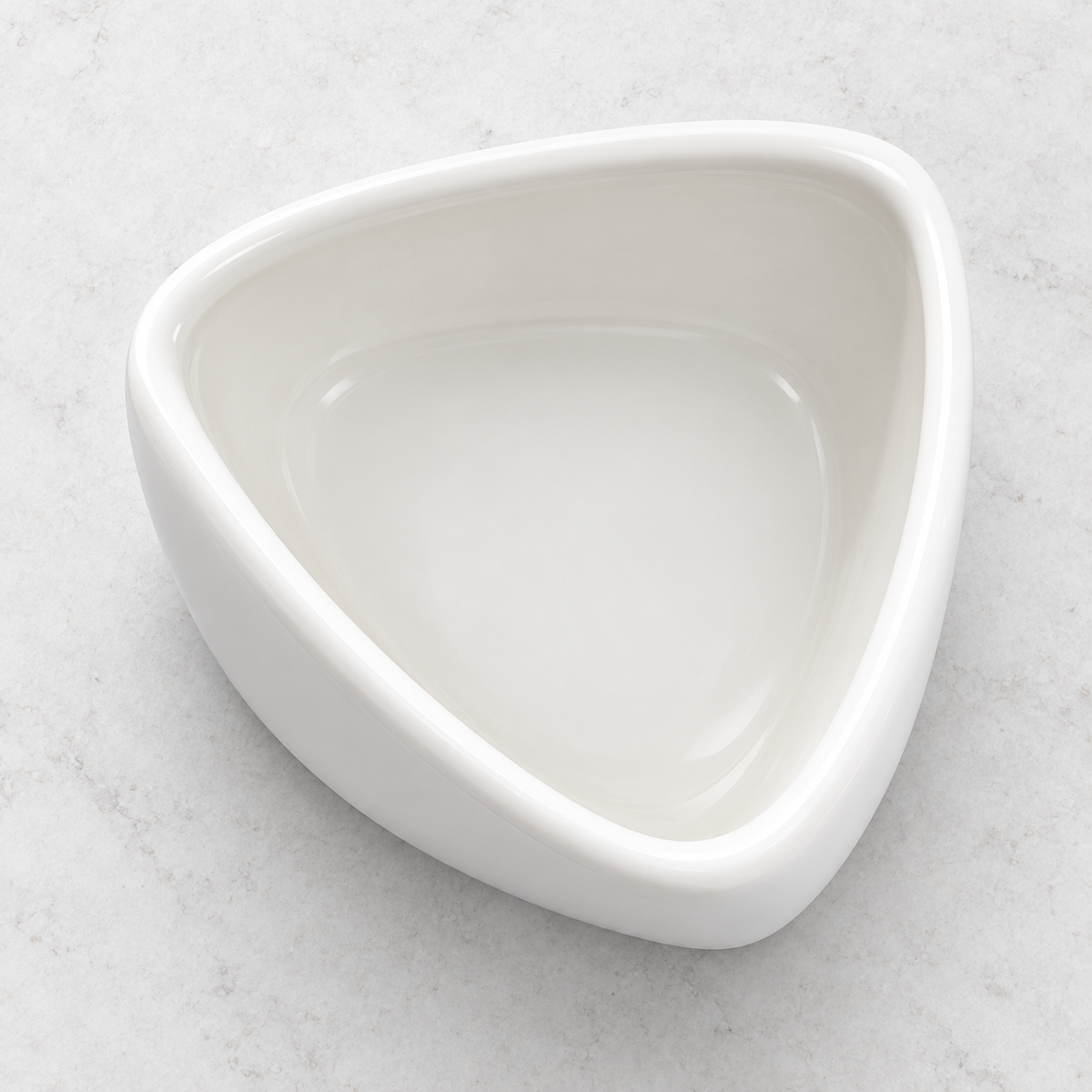 Top view into the triangular opening of the folded-edge porcelain bowl