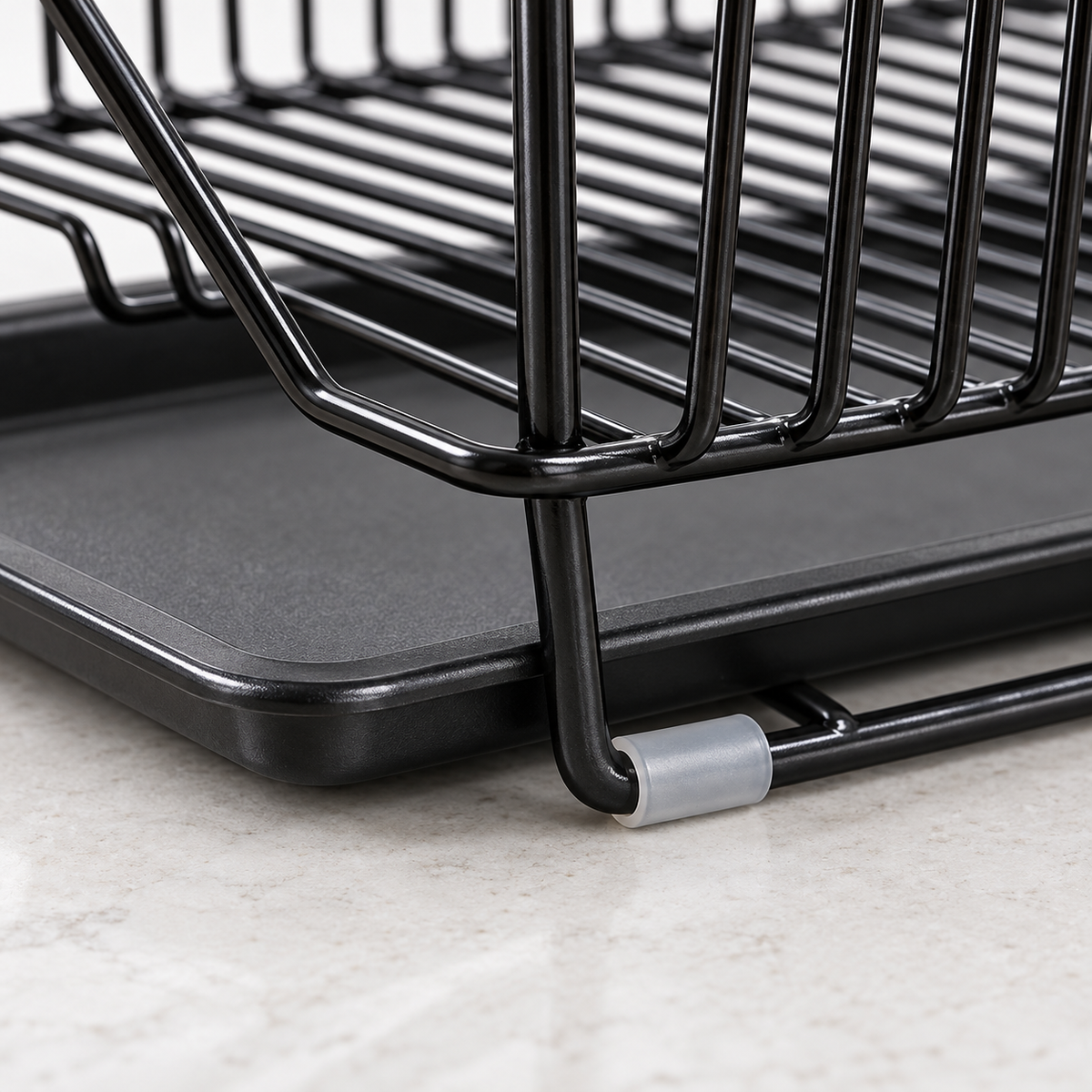 Detail of the dish rack foot, protective sleeve and drip-tray lip