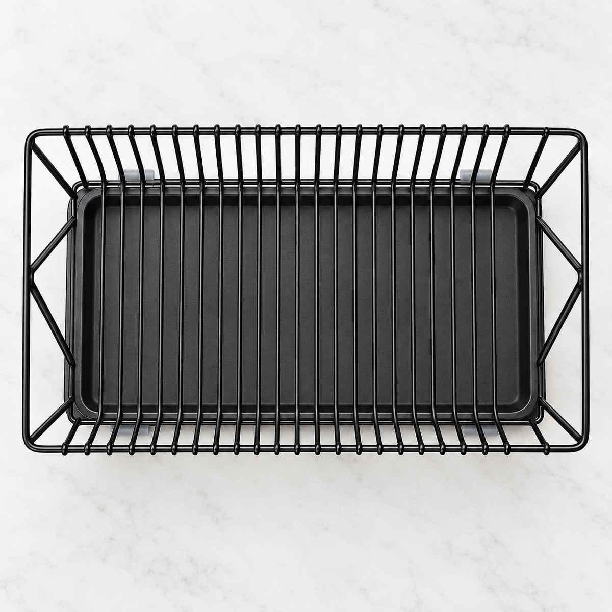 Overhead view of the empty black wire dish rack and drip tray
