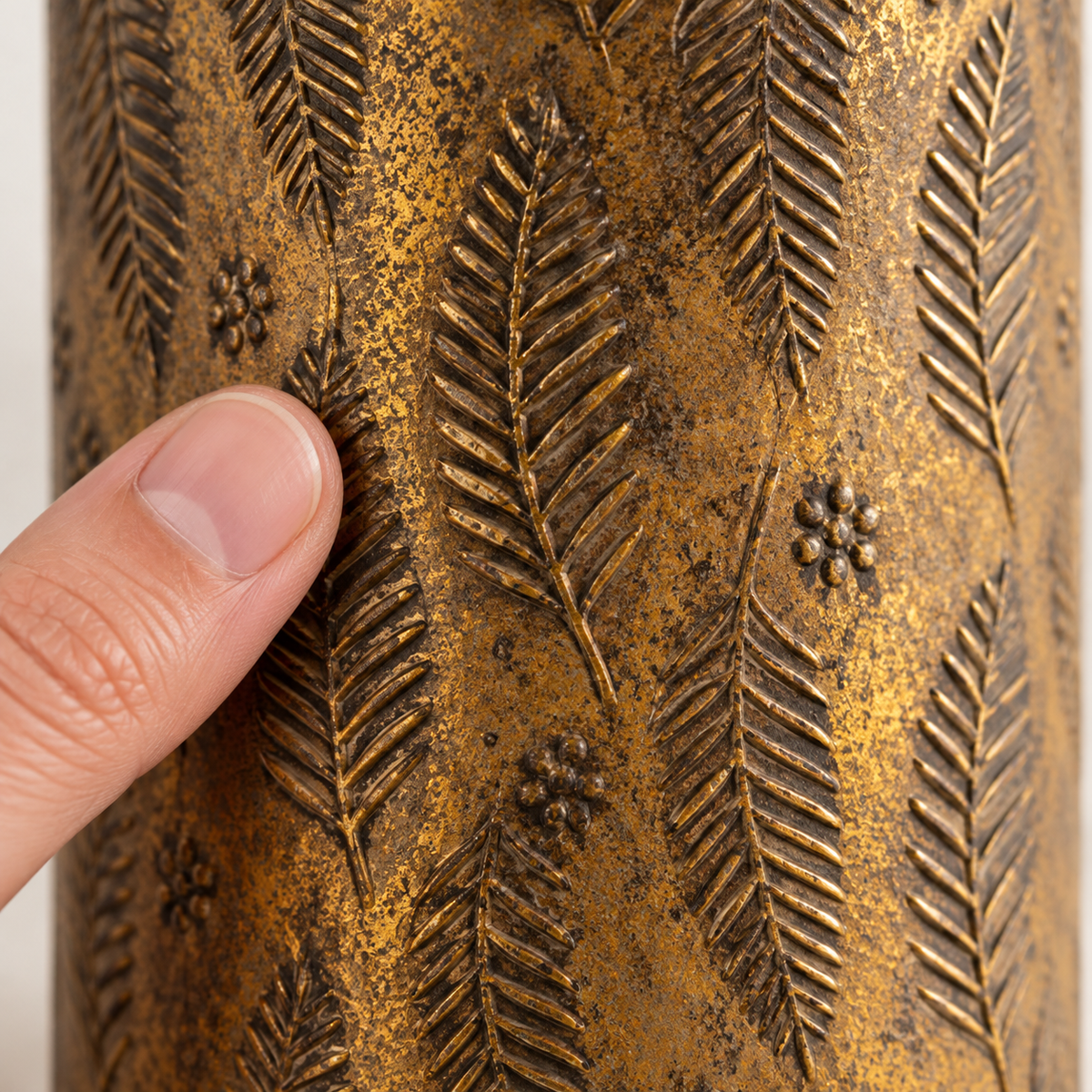 Close-up of embossed fern pattern and antique bronze finish