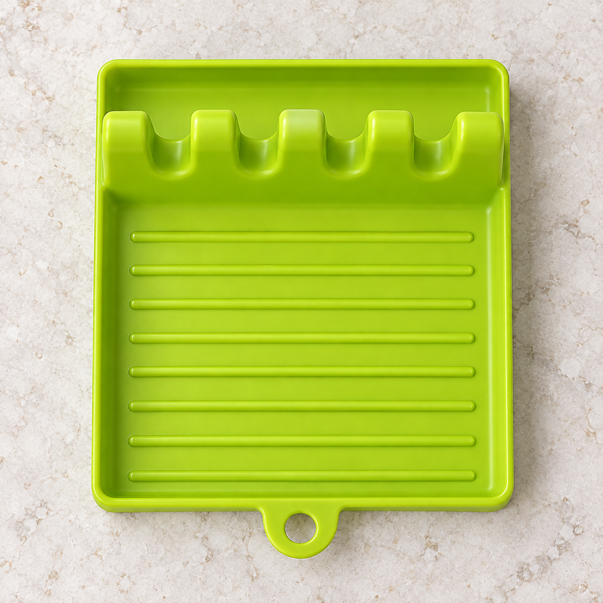 Green four-slot utensil tray viewed from above