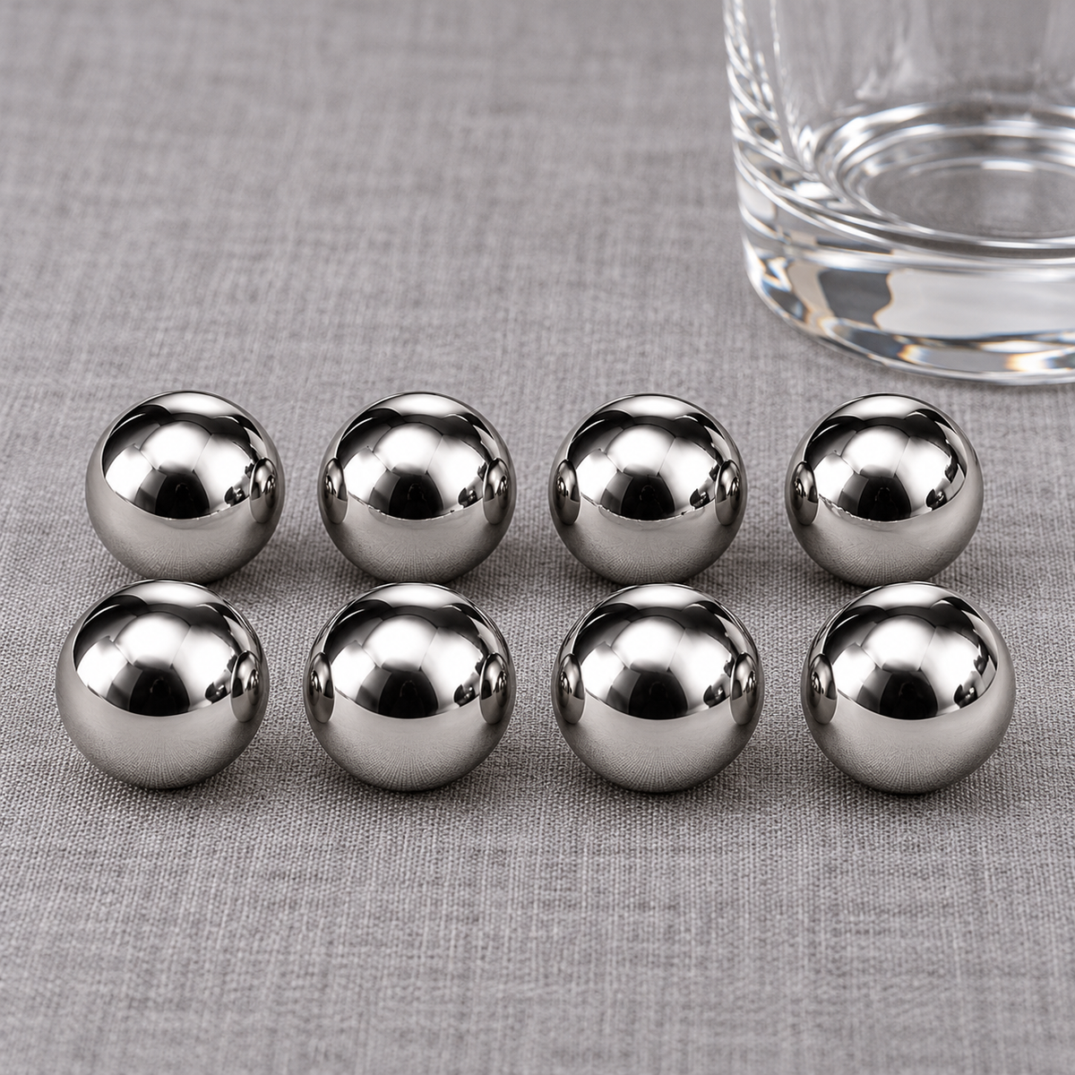Eight circular whiskey cooling pieces in two rows. Glass and linen are styling props and are not included.