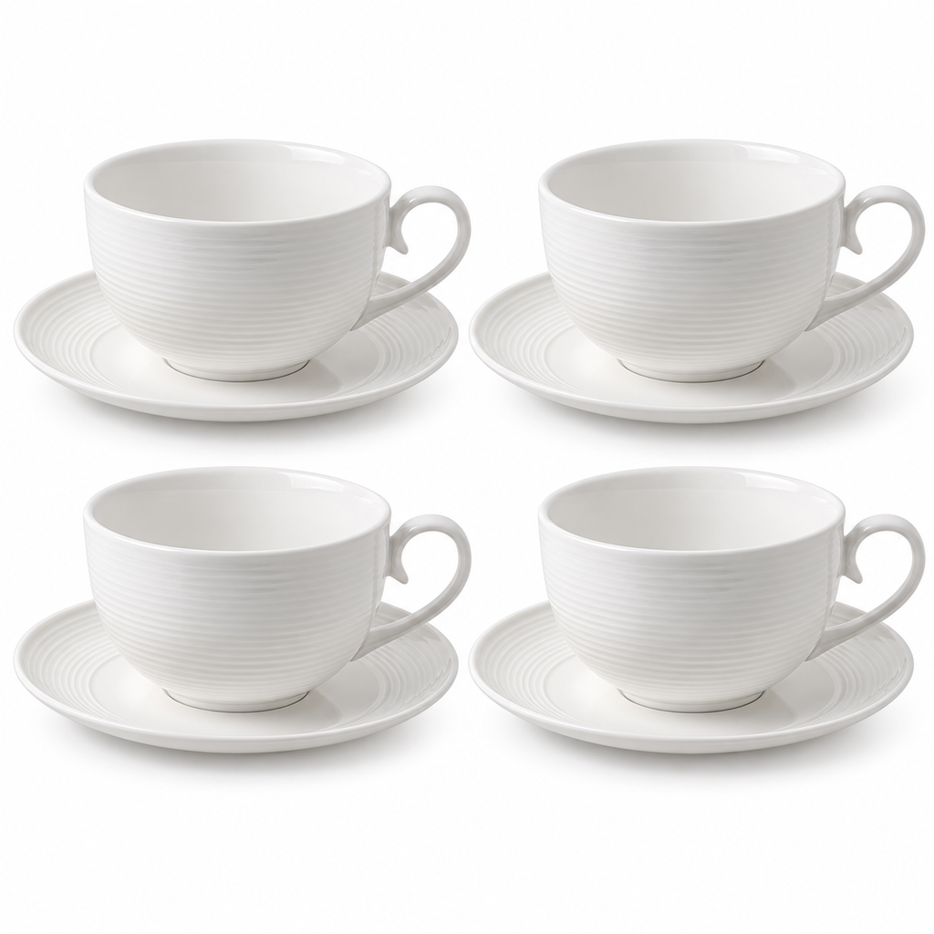 Four white ribbed ceramic cappuccino cups with four matching saucers on a white background.