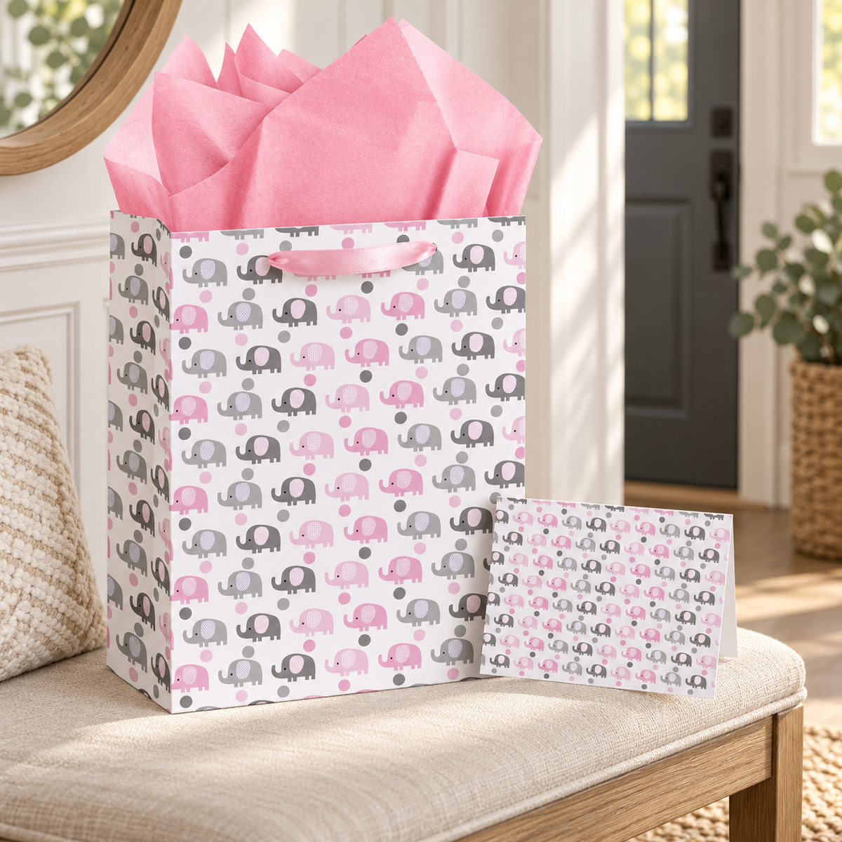 Pink elephant gift bag with tissue and matching card ready to take to a celebration