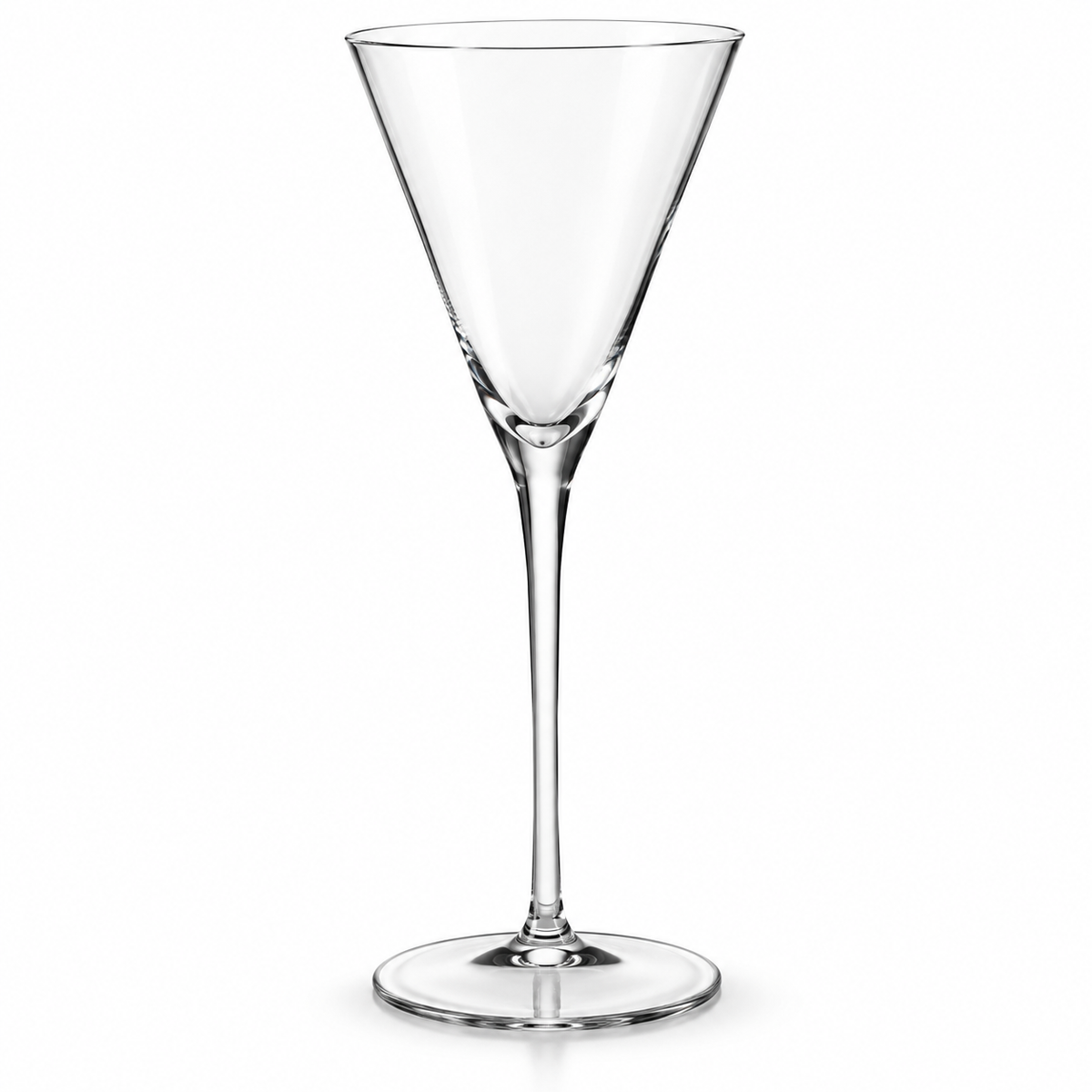 Empty tall tapered crystal cocktail glass on white