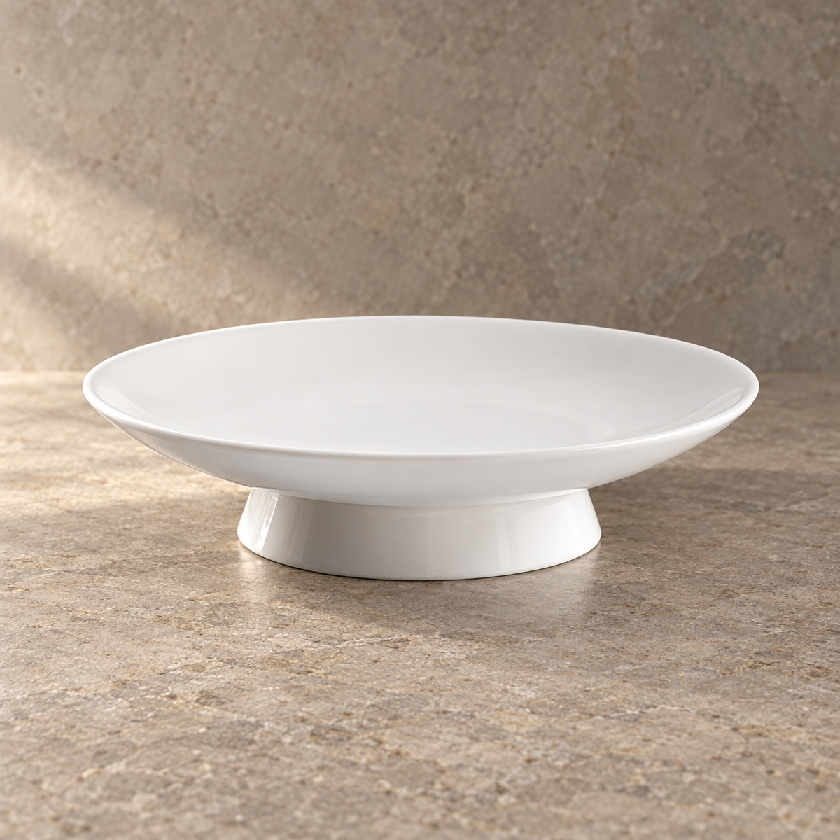 White Ceramic Footed Serving Plate — ceramic shape and glaze detail