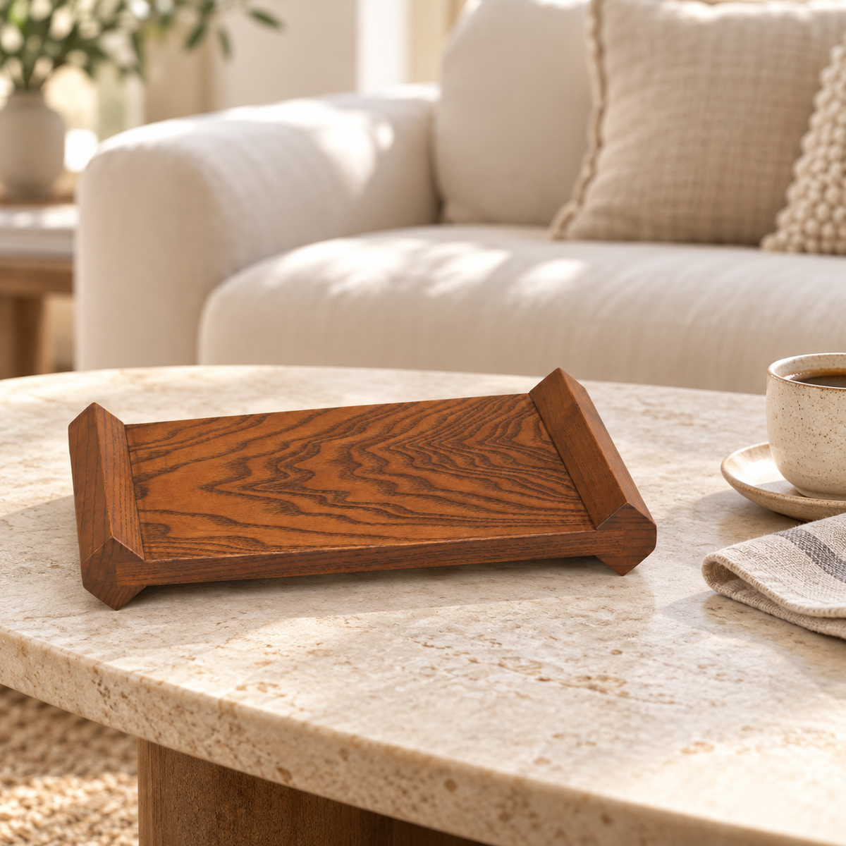 Wooden display riser styled on a living-room coffee table with a cup and saucer beside it; accessories not included