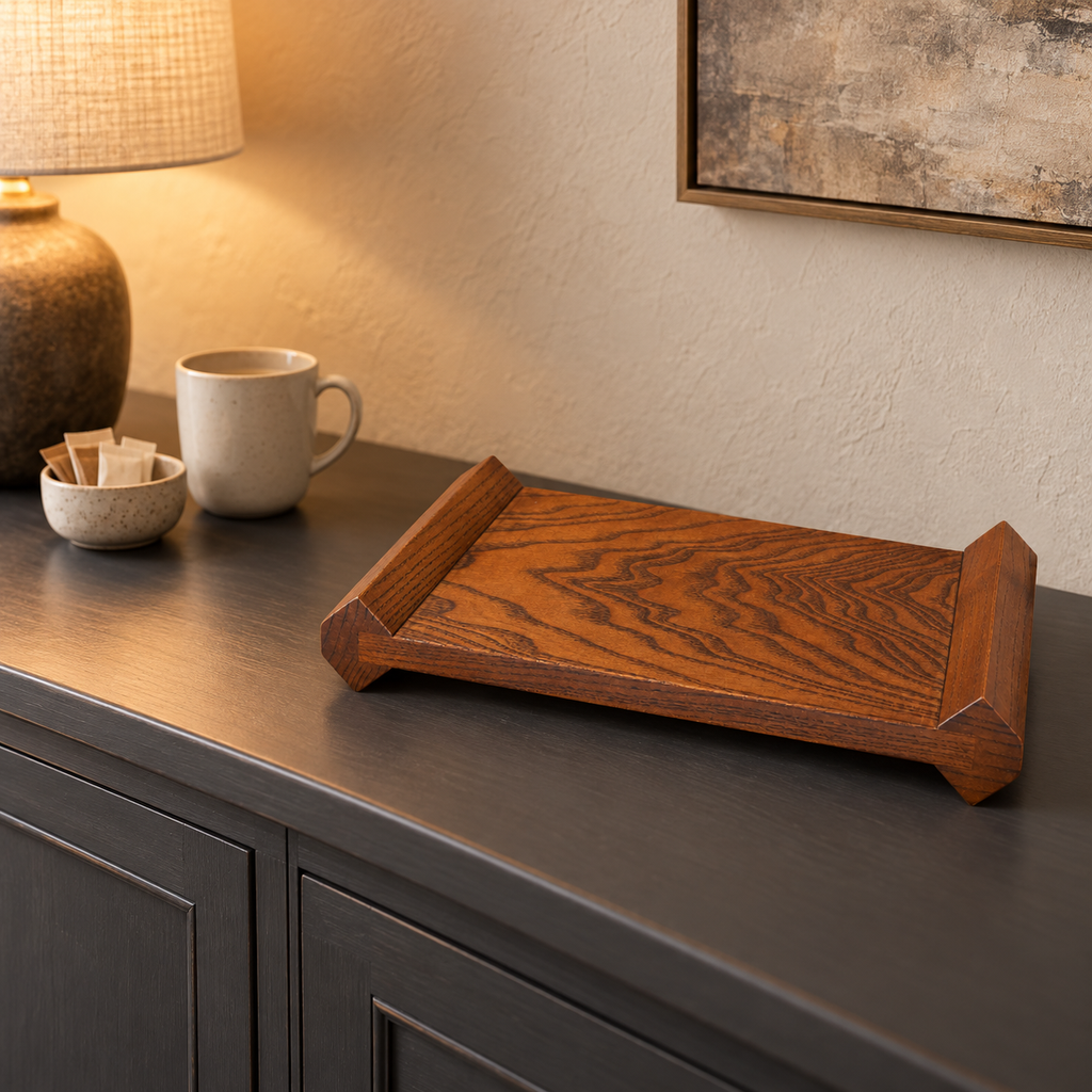Wooden display riser on a dark sideboard beside a coffee cup and sugar packets; accessories not included