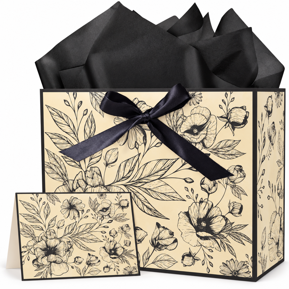 Vintage floral gift bag with black ribbon bow, tissue and matching card on white background